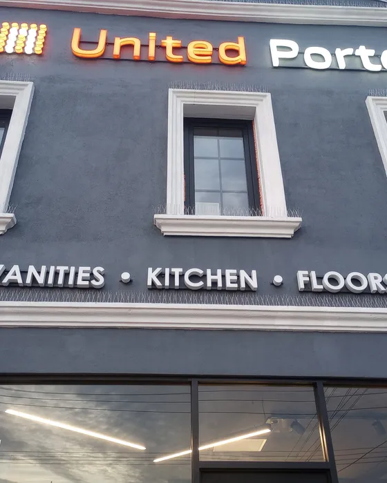 Storefront building facade with fresh paint and white window trim